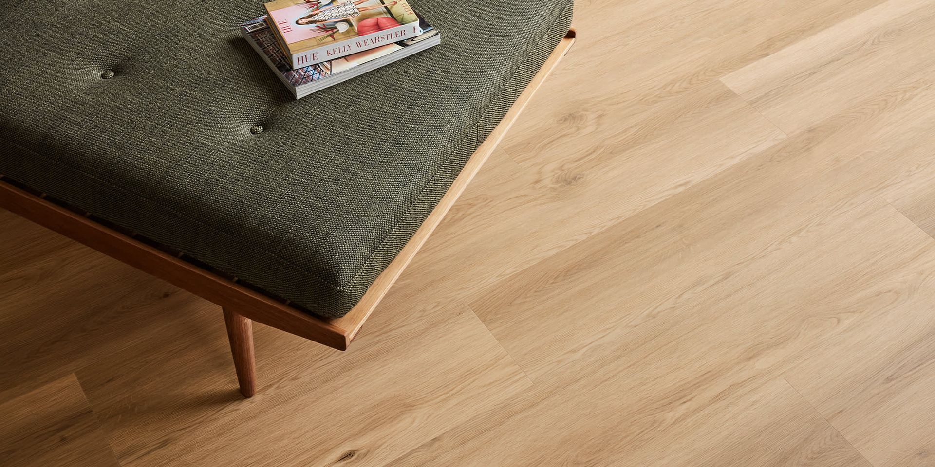 A Living Room with A Couch and Pillows on The Floor — Kelwin Coastal Carpets In Kundra Park, QLD
