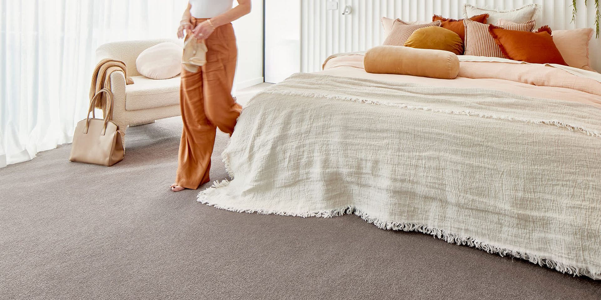 A Bathroom with A Tub, Sink, Mirror and Window — Kelwin Coastal Carpets In Kundra Park, QLD