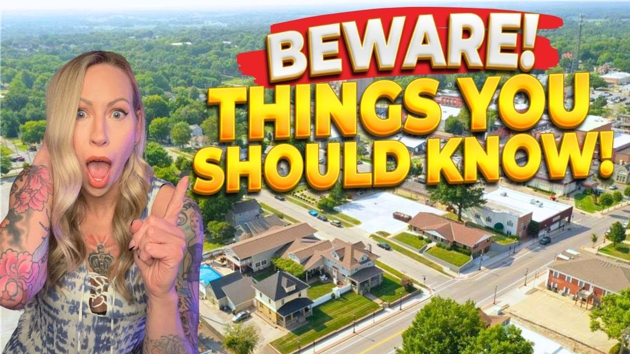 A woman is standing in front of a sign that says beware things you should know