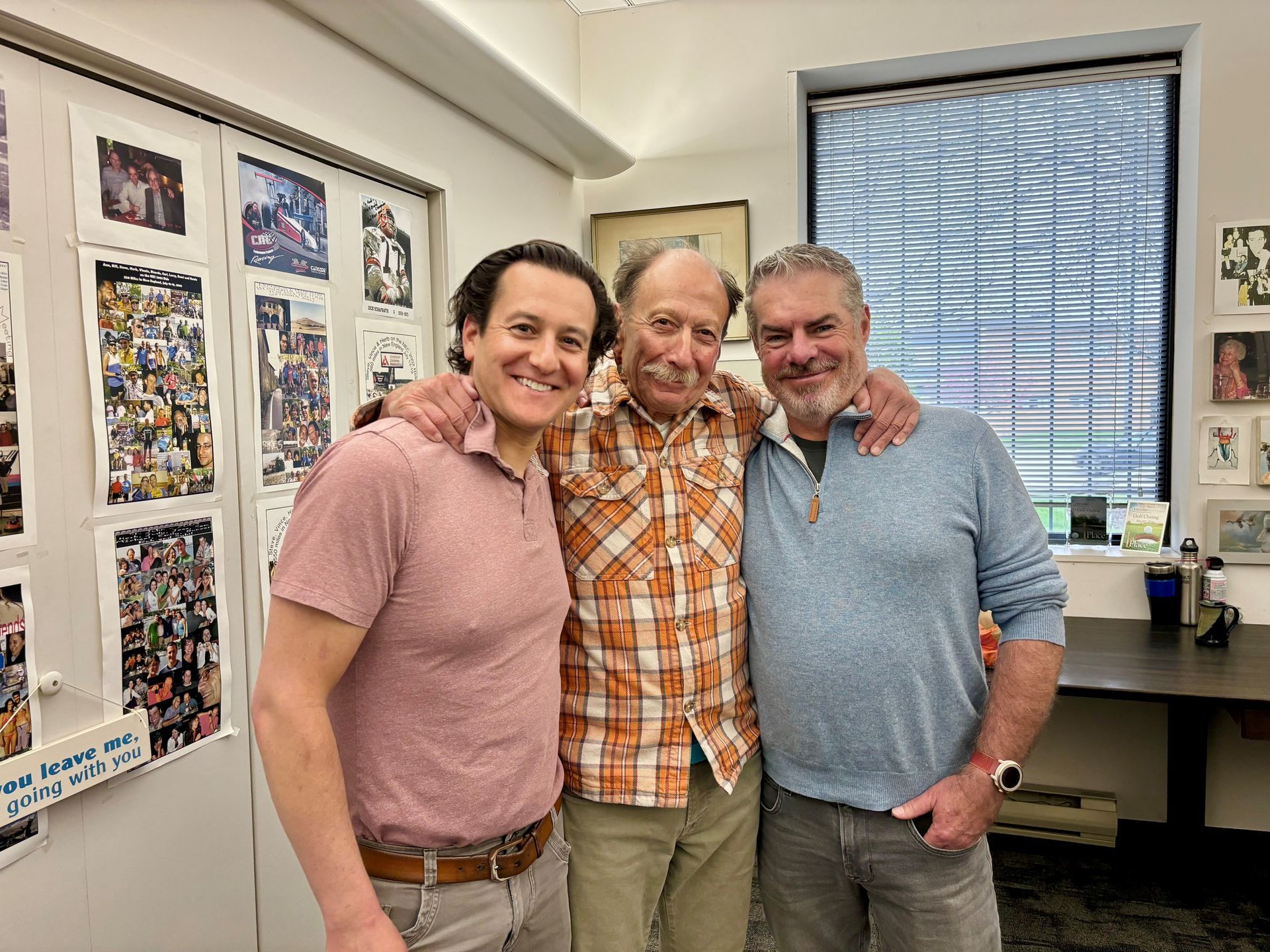 A small green seedling growing out of a pile of dark brown soil.