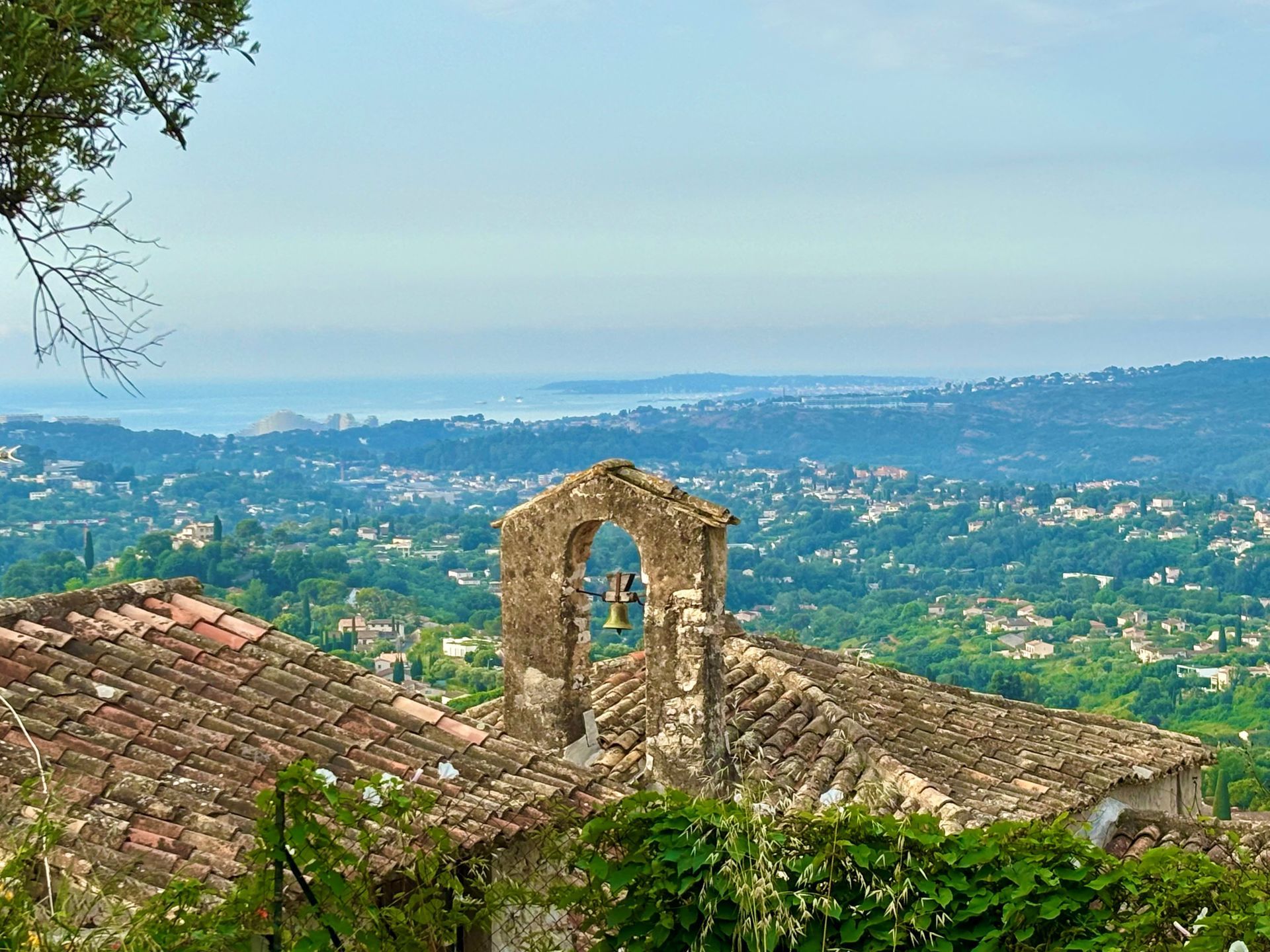 A group of people are sitting around a table looking at laptops.