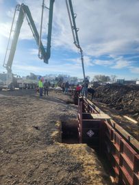 A group of construction workers are working on a construction site.