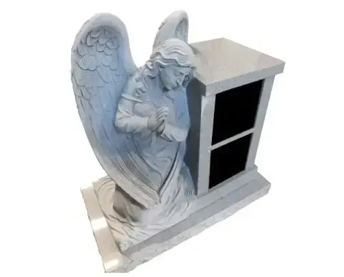 Gray angel statue with folded hands next to a gray columbarium.