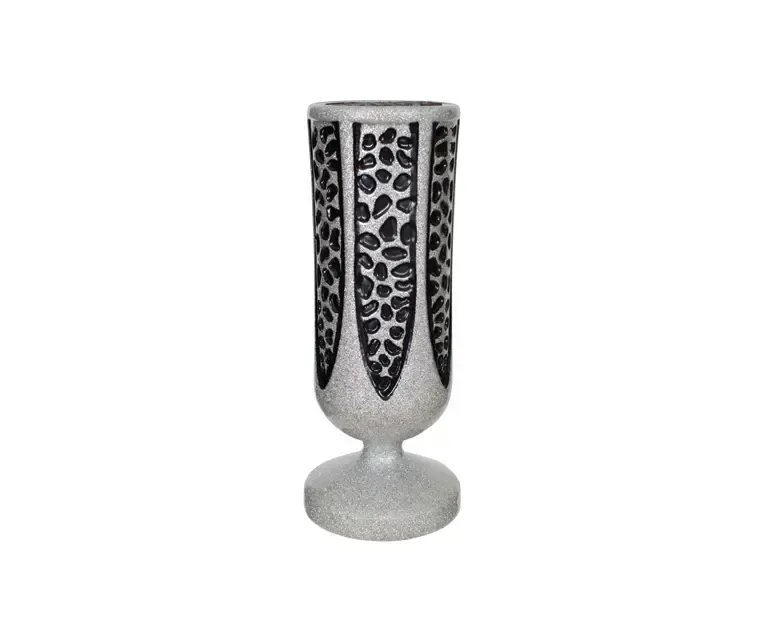 Silver vase with black pebble design.