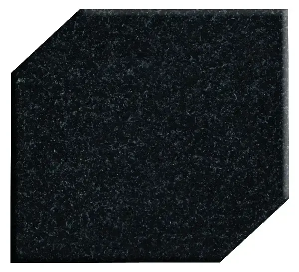 Dark gray, angled square with a textured, speckled surface.