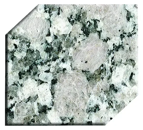 Granite countertop sample with white and grey specks, dark green clusters, and large pinkish-white patches.