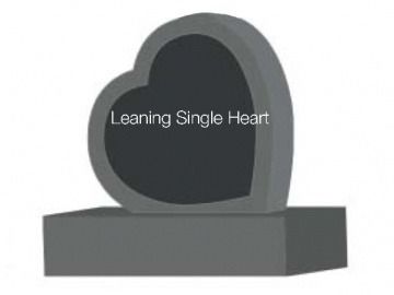 Gray heart-shaped gravestone with a smaller heart in the center, resting on a rectangular base.