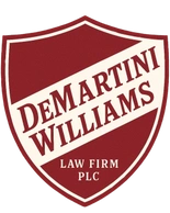 DeMartini Williams Law Firm PLC logo: red and white shield with text.