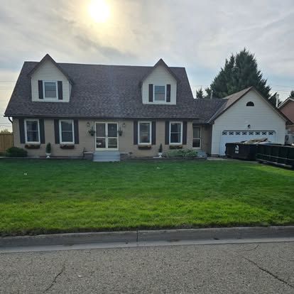 A large house with a large lawn in front of it