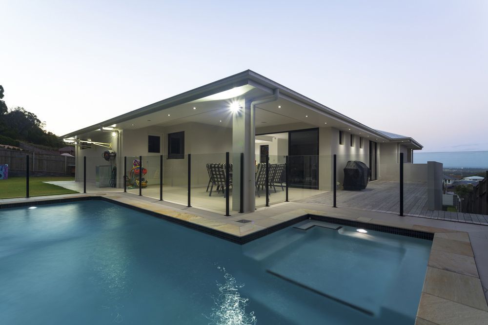 Swimming Pool With Glass Fencing — Glass Pool Fencing Byron Bay & Tweed Heads
