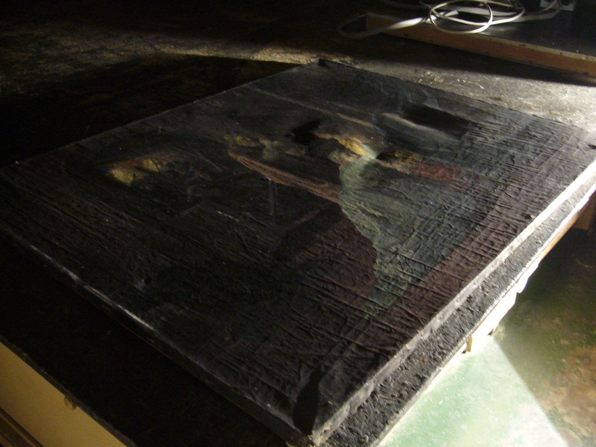 Poor canvas surface before treatment shown in raking light