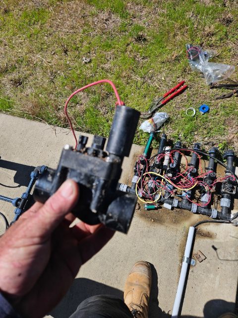 Close up of a hand repairing pipes with a wrench - Plumber in Mount Low, QLD