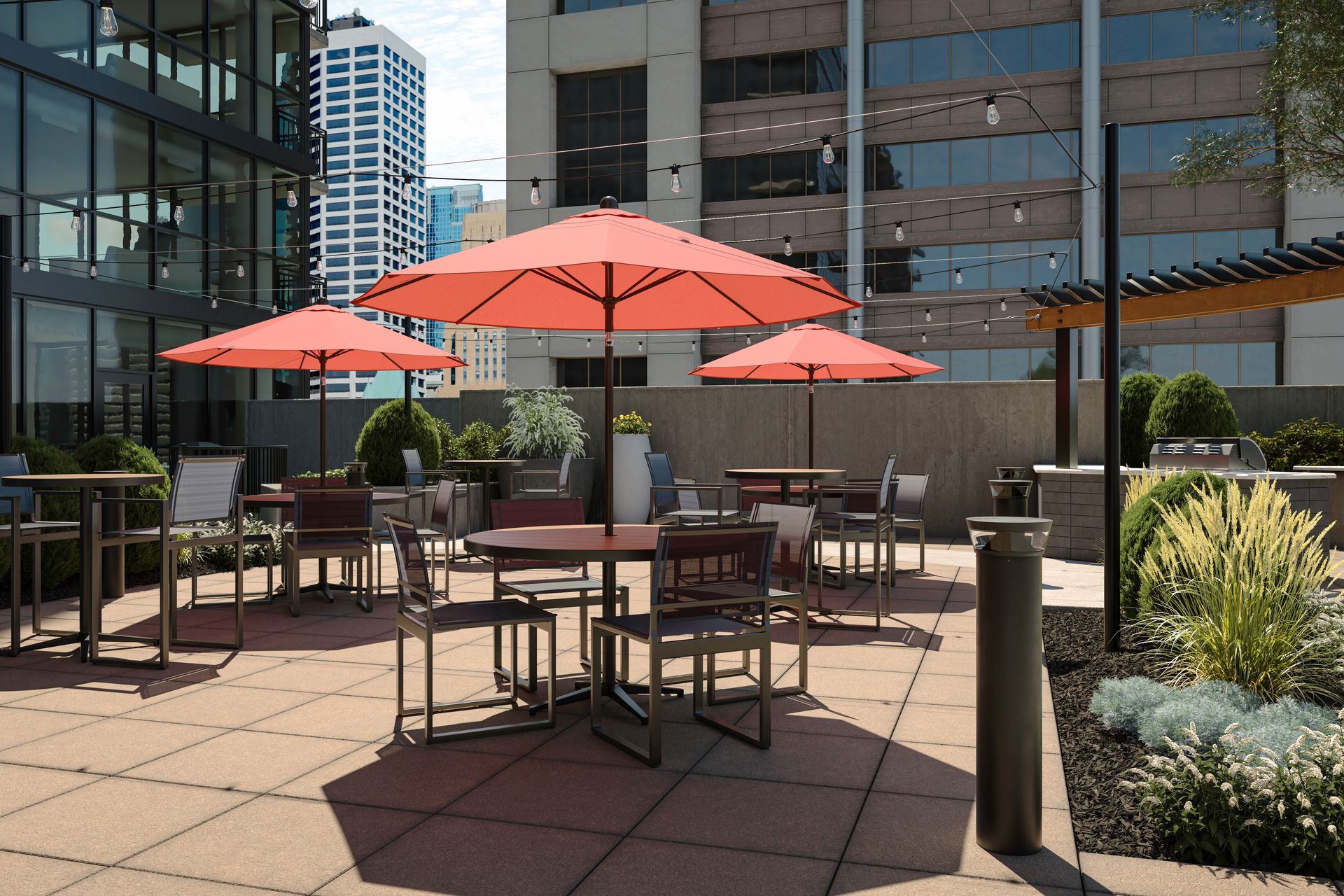 A patio with tables and chairs and red umbrellas at 4th & Park