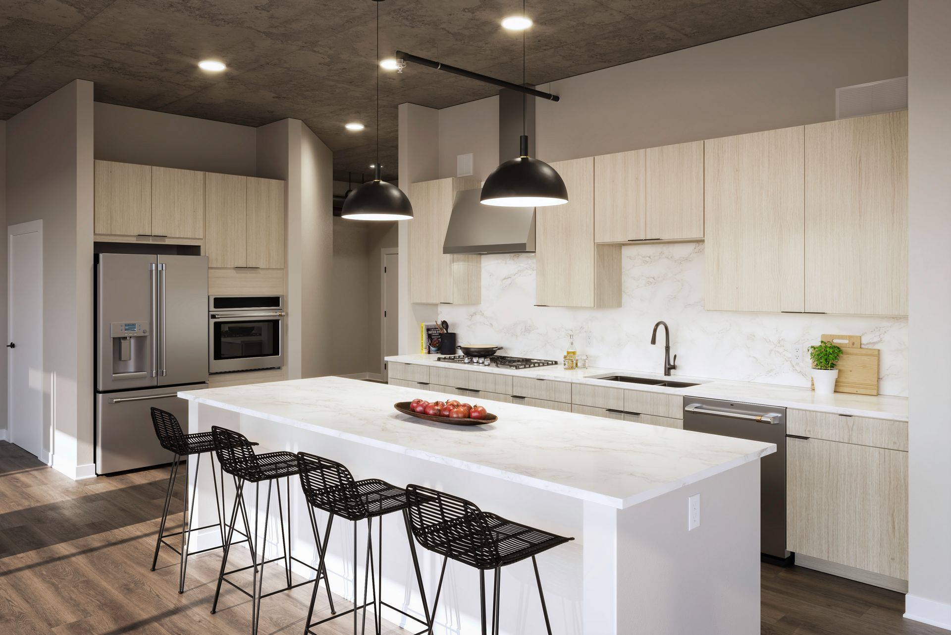 A kitchen with a large island and stools at 4th & Park
