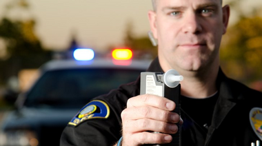 Man drinking alcohol while driving — DUI in Pocatello, ID