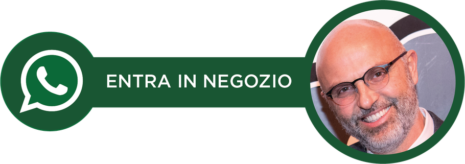 Un uomo con gli occhiali e la barba sorride in un cerchio verde.