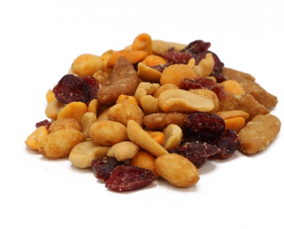 a pile of nuts and cranberries on a white background