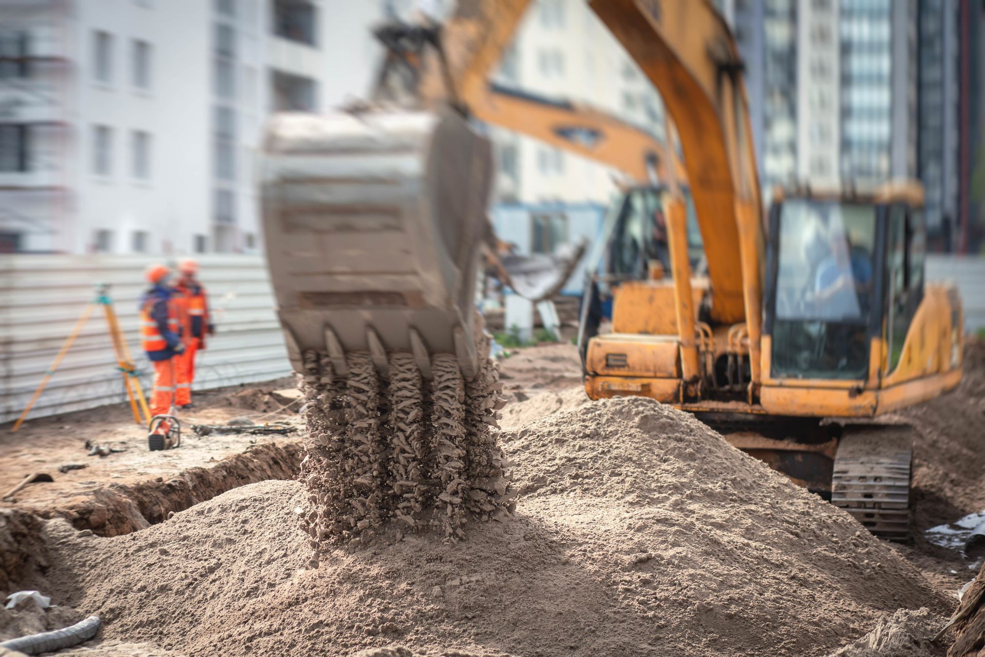 A bulldozer is moving dirt on a construction site.