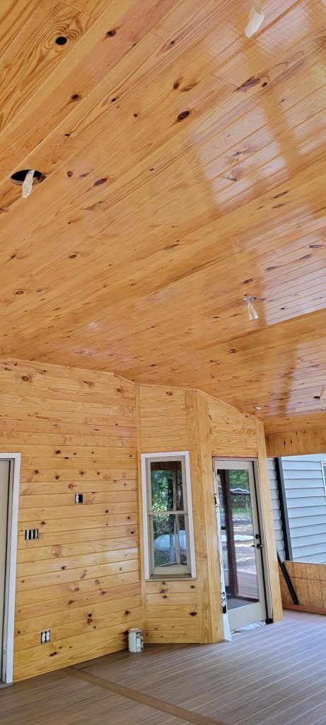 A Large Room With a Wooden Ceiling and Walls