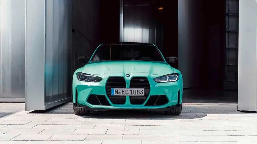 Turquoise sports car parked in a modern garage entrance