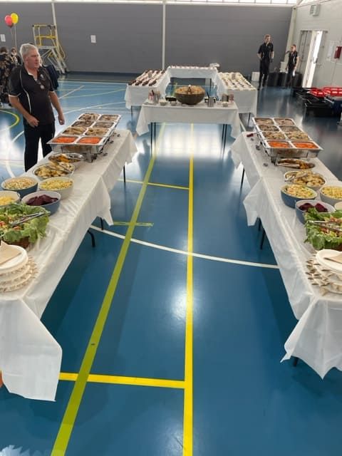 A Bunch Of Tables With Food On Them In A Gym — Tru Blu Catering In Woolgoolga, NSW