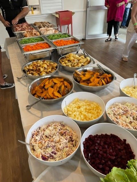 A Buffet Table With Bowls Of Food On It — Tru Blu Catering In Lake Cathie, NSW