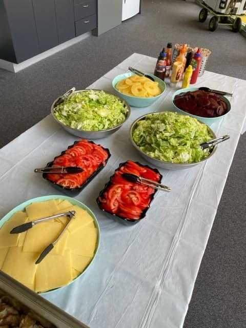 A Table With Bowls Of Vegetables And Cheese On It — Tru Blu Catering In Sawtell, NSW