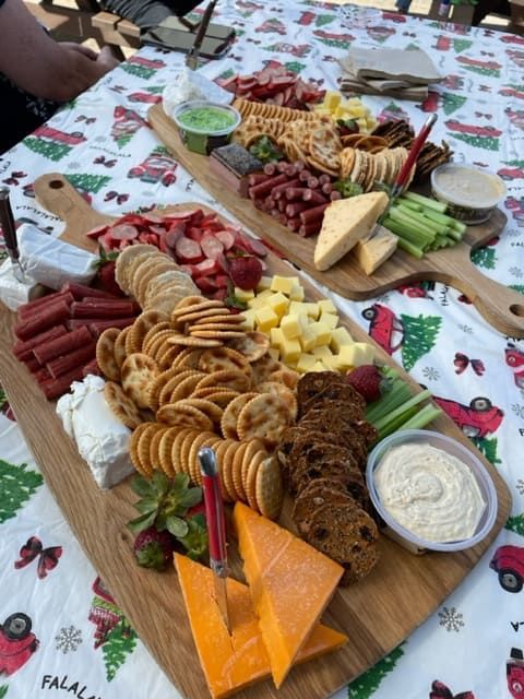 Two Wooden Boards Filled With Lots Of Food On A Table — Tru Blu Catering In Sawtell, NSW