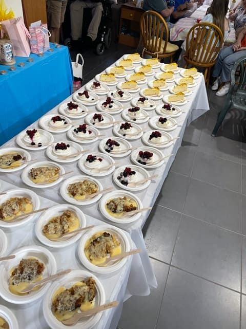 A Table With Many Plates Of Food On It — Tru Blu Catering In Coffs Harbour, NSW