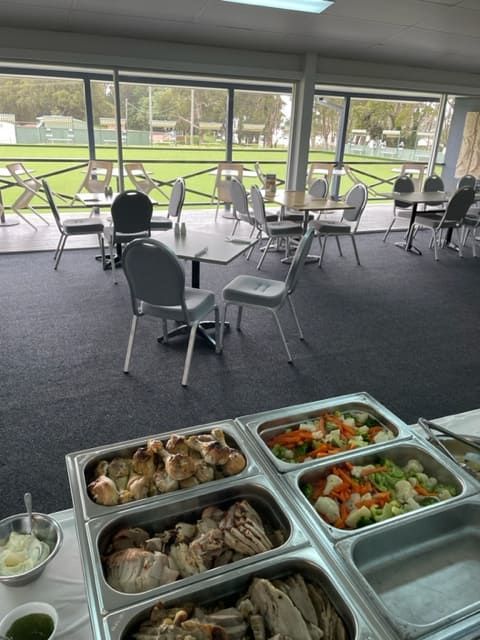 A Buffet Line In A Restaurant With Tables And Chairs — Tru Blu Catering In Laurieton, NSW