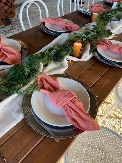 A Wooden Table With Plates And Napkins On It — Tru Blu Catering In Laurieton, NSW