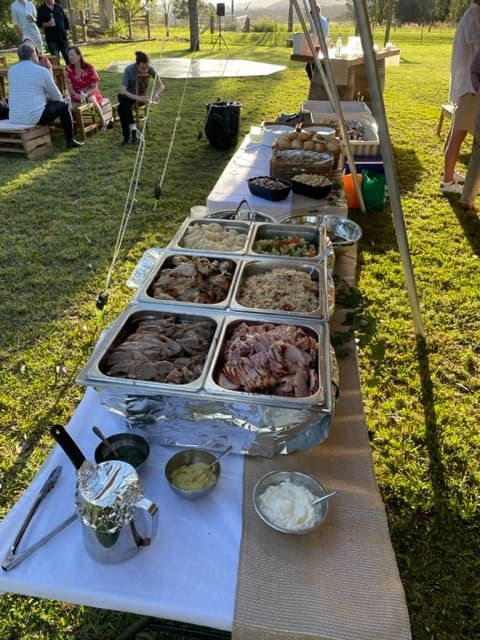 A Long Table With A Variety Of Food On It — Tru Blu Catering In Nambucca, NSW