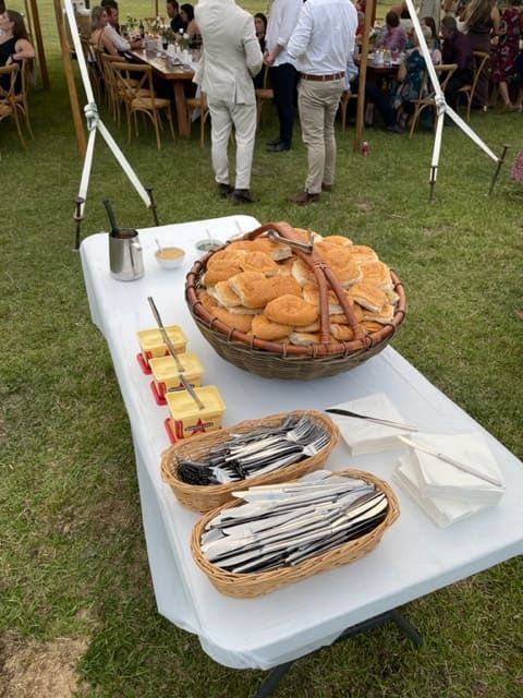 A Table With A Basket Of Bread On It — Tru Blu Catering In Wauchope, NSW