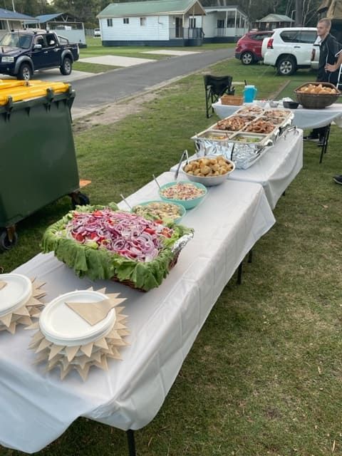 A Table With Plates And Bowls Of Food On It — Tru Blu Catering In Port Macquarie, NSW