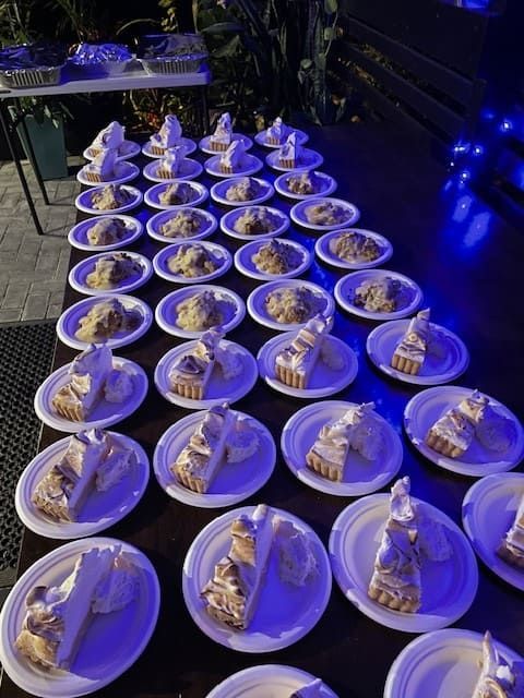 A Table Topped With Plates Of Pie Slices — Tru Blu Catering In Port Macquarie, NSW