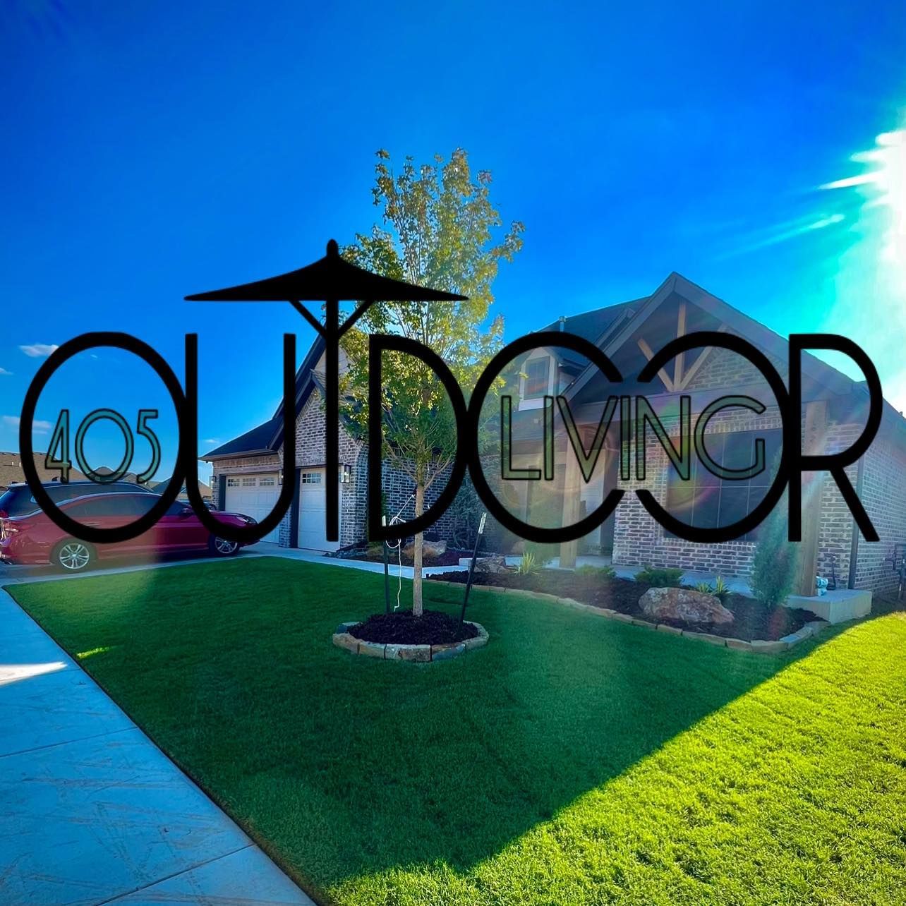 405 Outdoor Living logo over a home with lawn. Sunny day, green grass, red car in driveway.