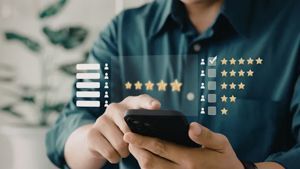 Person holding a smartphone with a digital overlay showing a five-star customer feedback rating system.