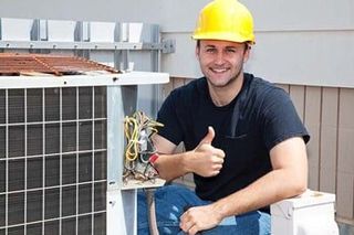 Air Conditioner Repairman Thumbs up — Air Conditioning in Saginaw, MI