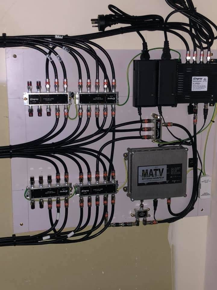 A Wall-mounted Panel With Cable Splitters, Amplifiers, and Power Supplies — MATV Systems Australia Pty Ltd in Gold Coast, QLD