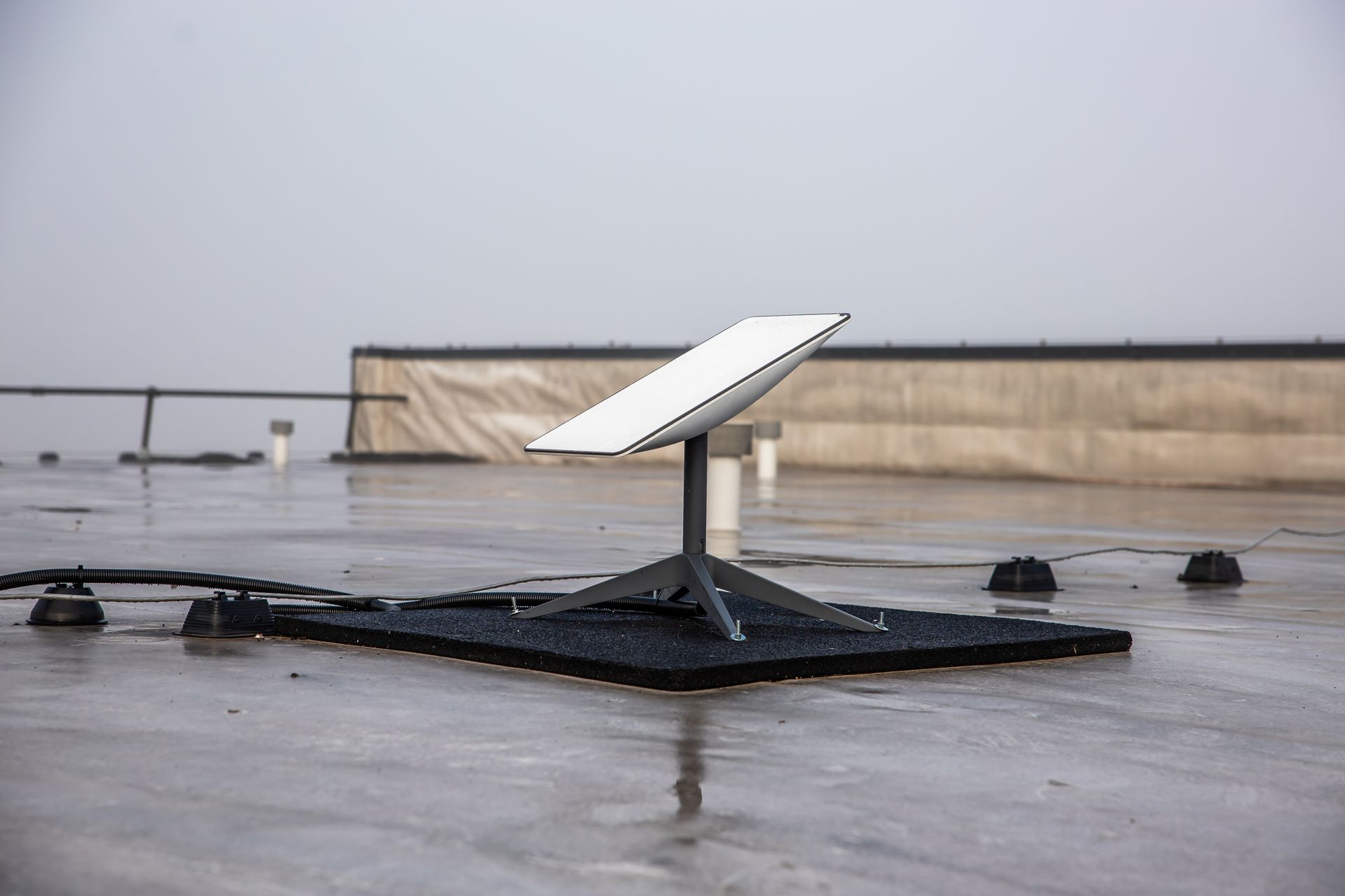 White Rooftop Starlink on a Black Mounting Base — MATV Systems Australia Pty Ltd in Wickham, NSW