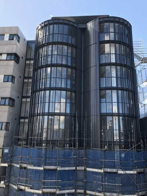 A Large Building with A Lot of Windows Is Under Construction — MATV Systems Australia Pty Ltd in Wickham, NSW