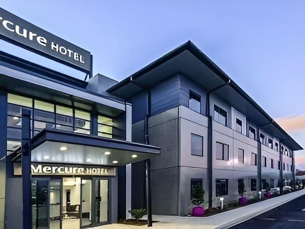 A Large Building with A Sign that Says Mercure Hotel — MATV Systems Australia in Mayfield, NSW