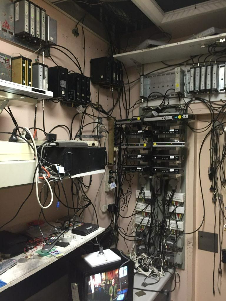 A Room with A Lot of Wires Hanging from The Ceiling — MATV Systems Australia Pty Ltd in Wickham, NSW