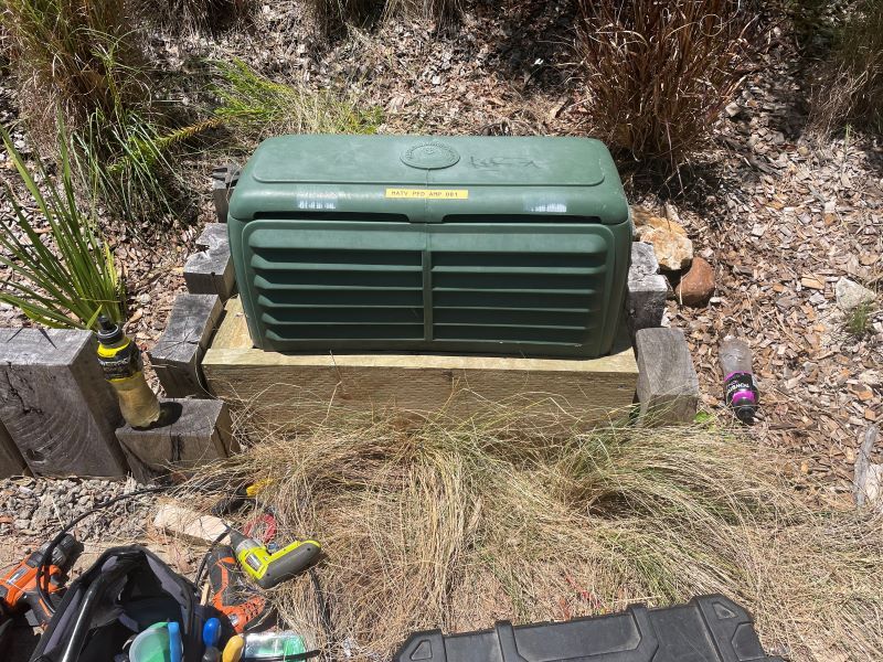 A Green Box Is Sitting on Top of A Wooden Platform — MATV Systems Australia Pty Ltd in Mayfield, NSW