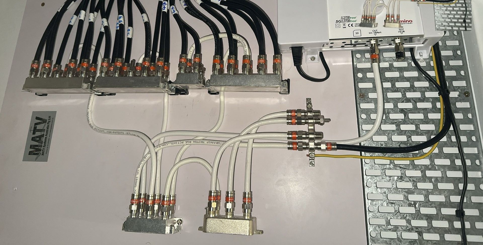 A Person Is Holding a Piece of Metal in Their Hand — MATV Systems Australia Pty Ltd in Port Stephens, NSW