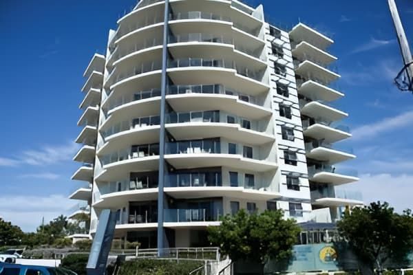 A Tall Building with A Lot of Balconies on A Sunny Day — MATV Systems Australia Pty Ltd in Wickham, NSW