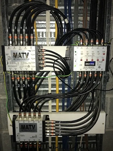 Dense Network of Black Cables Connecting Multiple MATV Splitter Boxes — MATV Systems Australia Pty Ltd in Wickham, NSW