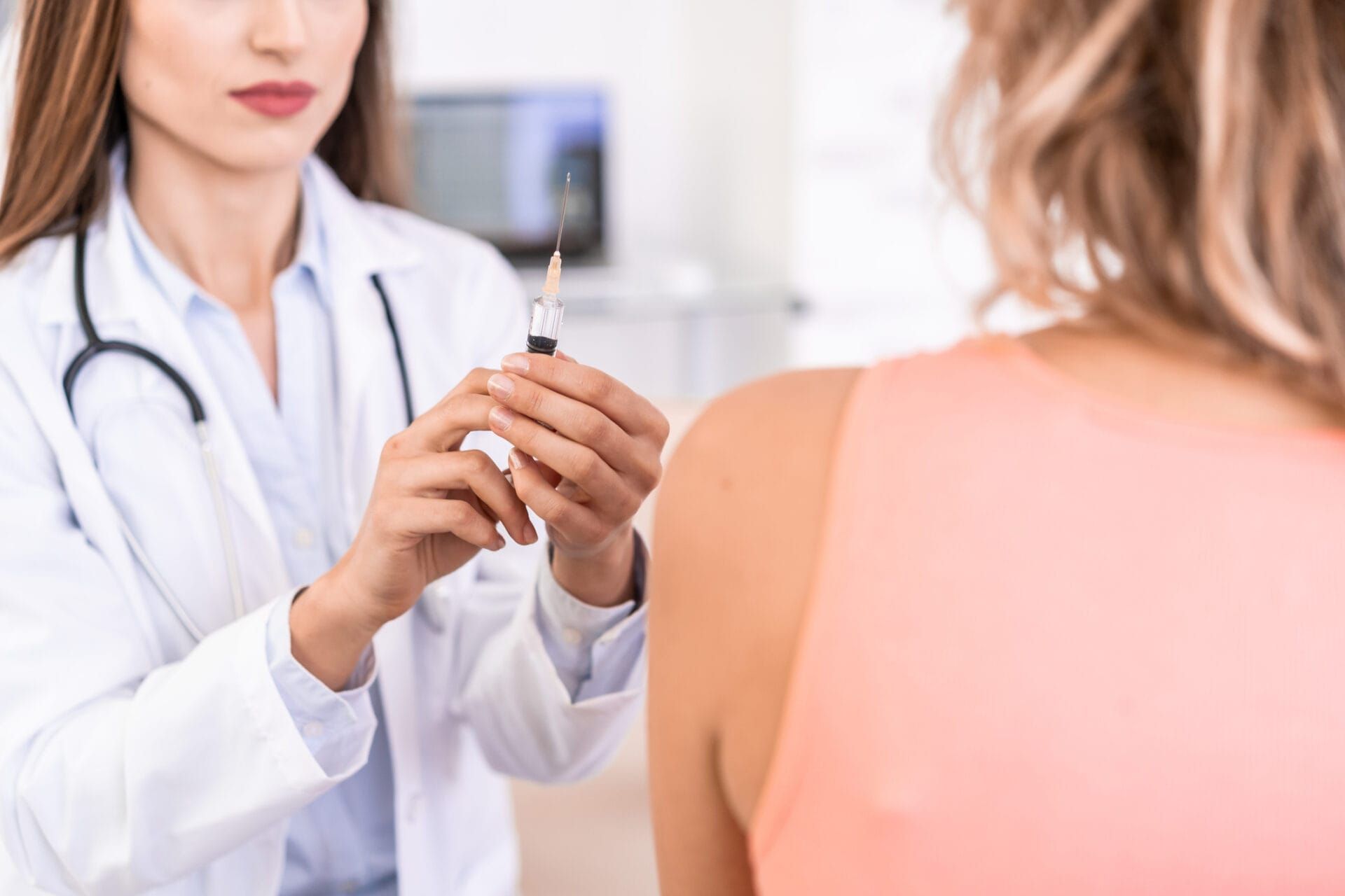 Woman on couch in therapy session with therapist.