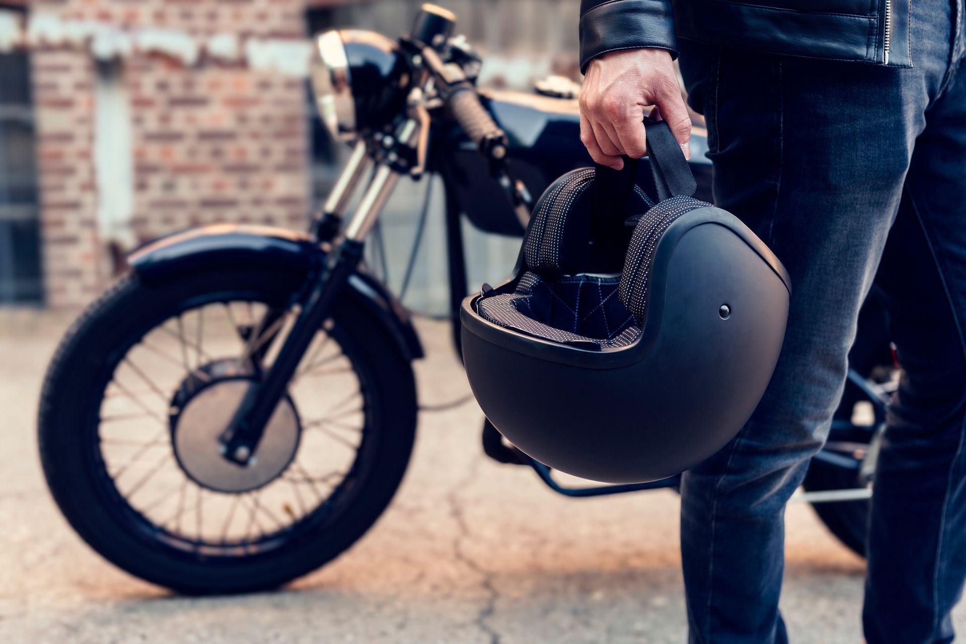 Motorcyclist Carries His Motorcycle Helmet — Albuquerque, NM — Pirkle Insurance Agency Inc. - Allstate Insurance