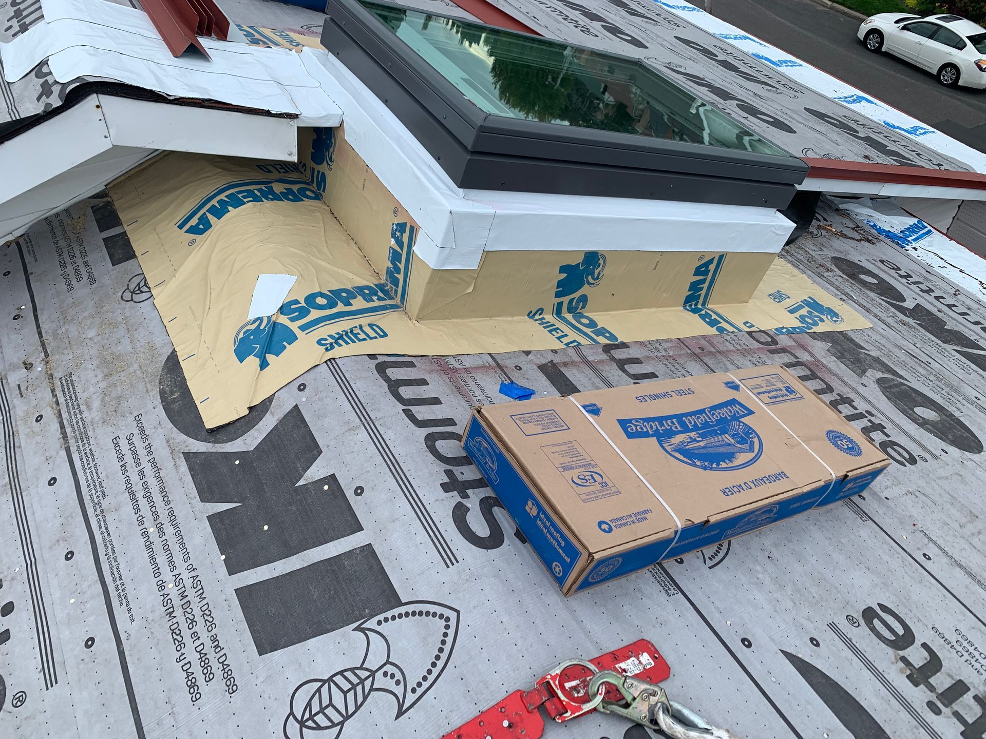 A skylight is being installed on the roof of a building
